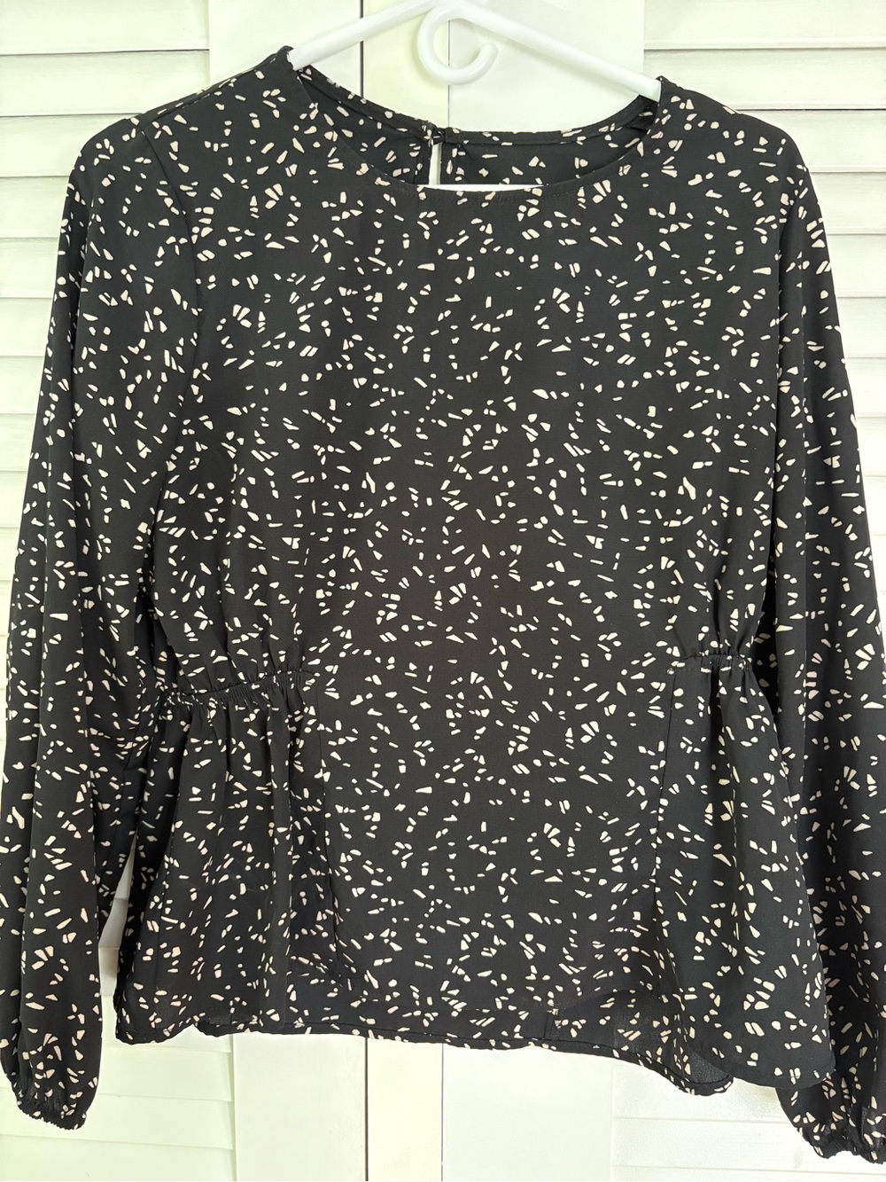 Kaileigh Black Top with Cream Speckled Print, Long Sleeve Peplum